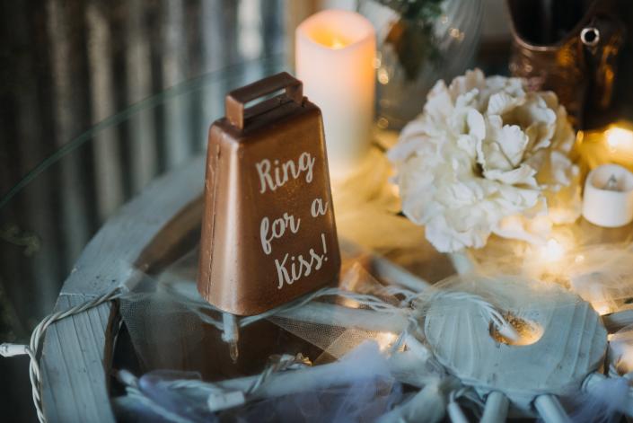 Cowbell Kisses welcome Mr. and Mrs. to start things off right!