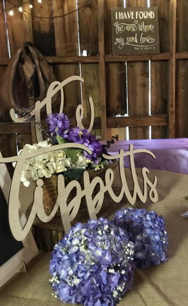 Her bridesmaids set up this gorgeous welcome table for the bride and groom